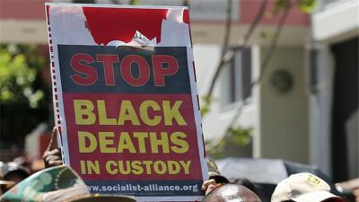 Protesters highlight the fight for justice for Aboriginal deaths in police custody or in prisons [AP]